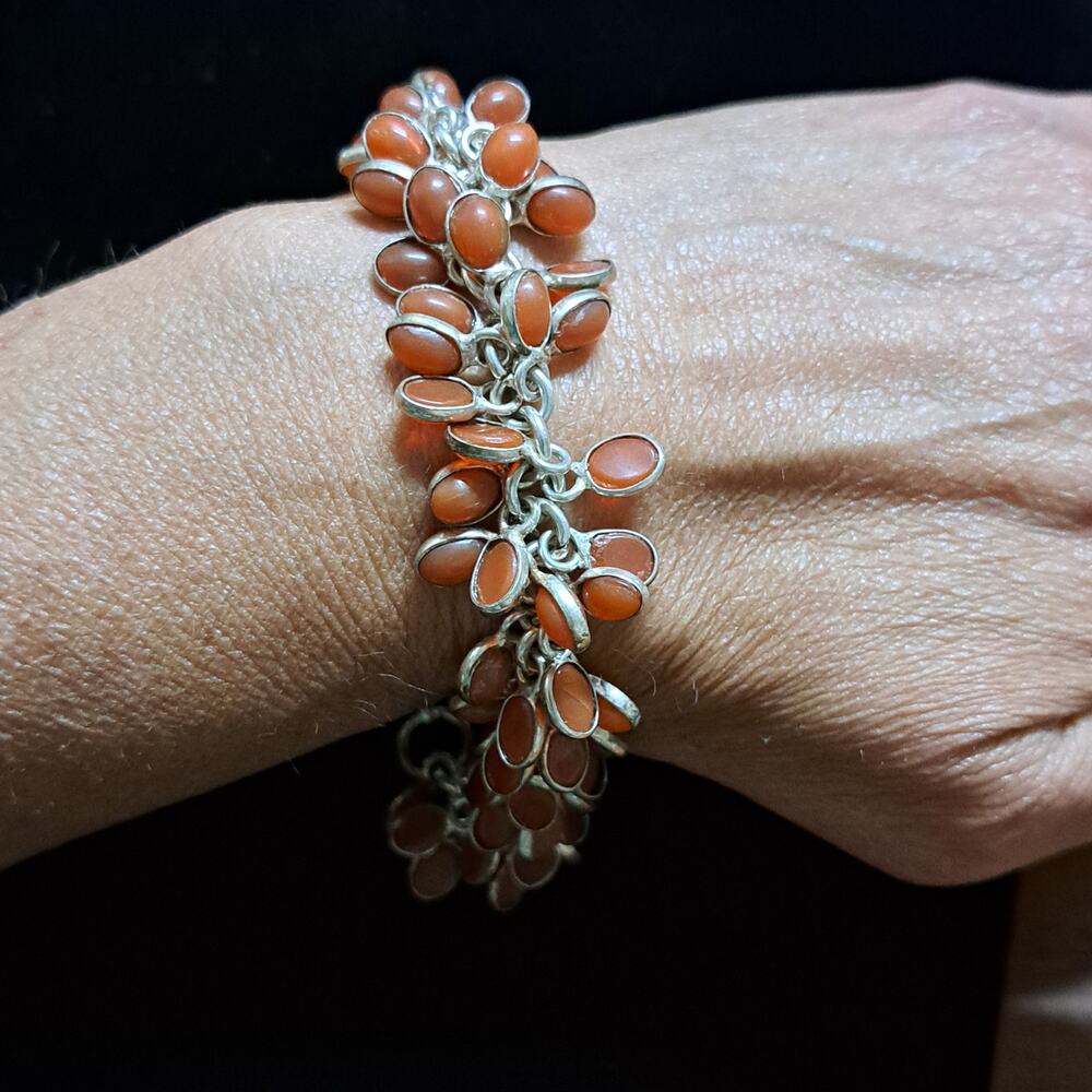 Oval-shaped orange stones, carnelian, set in silver-toned metal 9" Bracelet
